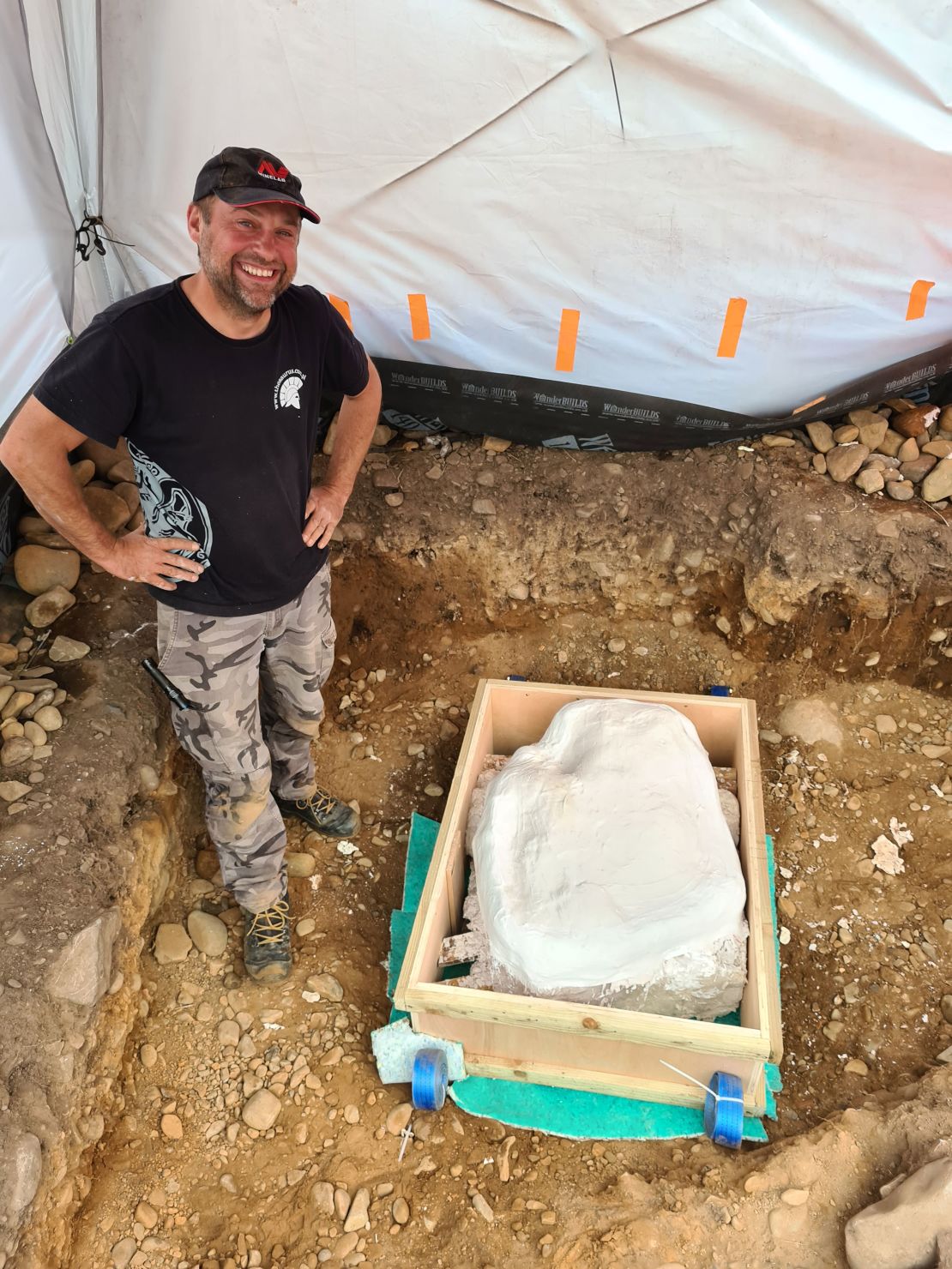 Mariusz Stepien stands next to the hoard, which is ready for transportation to Edinburgh.