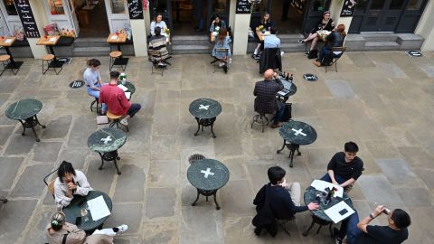 Customers sit at socially distanced tables in Covent Garden in London on July 4.