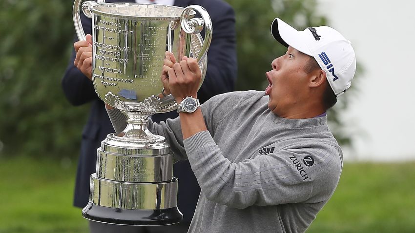 SAN FRANCISCO, CALIFORNIA - AUGUST 09: Collin Morikawa of the United States reacts as the lid to the Wanamaker Trophy falls off during the trophy presentation after the final round of the 2020 PGA Championship at TPC Harding Park on August 09, 2020 in San Francisco, California. (Photo by Sean M. Haffey/Getty Images)