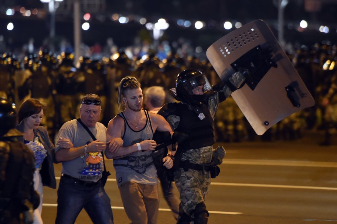 Riot police detain a group of demonstrators during a protest after polls closed in Belarus' presidential election, in Minsk on August 9, 2020. 