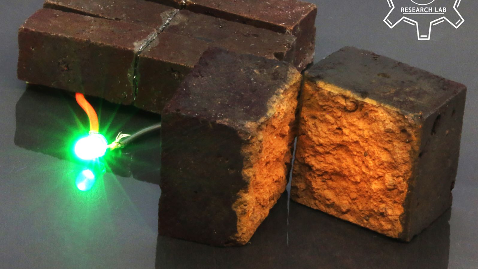 Here, a conventional brick has been transformed into an energy storage device that can power an LED light.