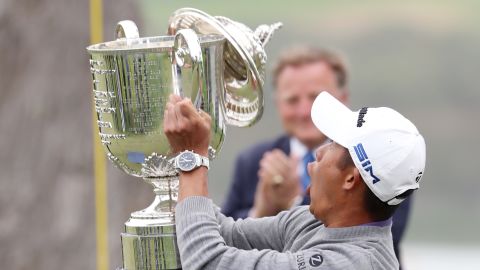 Morikawa reacts as the lid to the Wanamaker Trophy falls off during the trophy presentation after the 2020 PGA Championship.