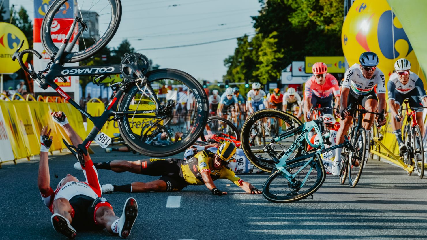 Dutch cyclist Dylan Groenewegen (on the ground, center) and fellow riders collide during the opening stage of the Tour of Poland. 