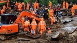 TOPSHOT - Rescue workers search for missing people at a landslide site caused by heavy rains in Pettimudy, in Kerala state, on August 8, 2020. (Photo by STR / AFP) (Photo by STR/AFP via Getty Images)