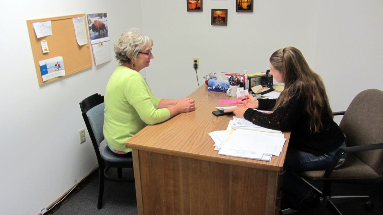 Mary Mason (left) is the director of Inter-Faith Response, which provides aid to tenants at risk of eviction in Council Bluffs. She is shown here with a volunteer.