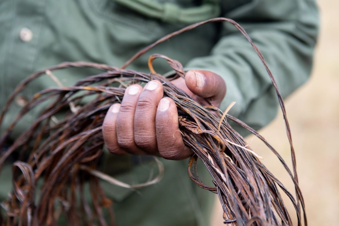 A ranger on a de-snaring patrol in Kenya's Mara Triangle holds items he's collected.