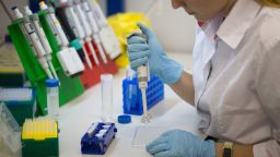 A lab technician uses a single channel pipette dropper in the immunogenicity testing process at the Gamaleya National Research Center in Moscow, Russia, on Thursday, August 6.