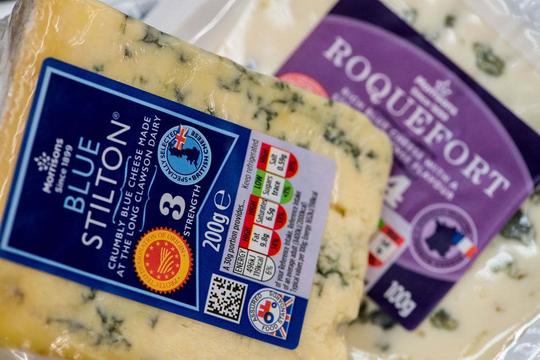 A British Blue Stilton sits on top of a French Roquefort inside a Morrisons supermarket in London.