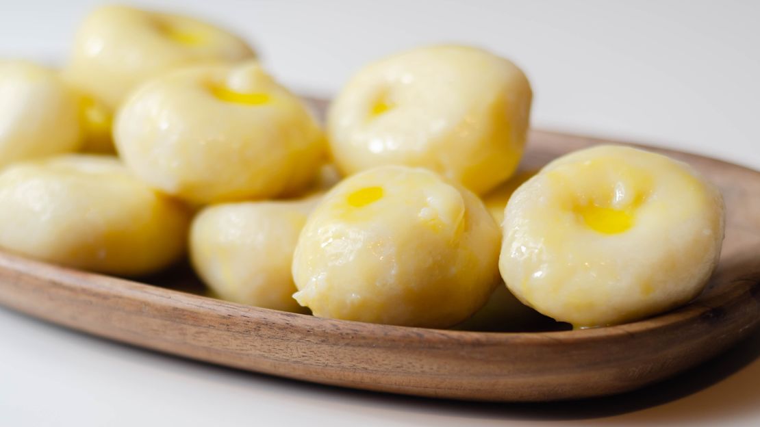 These tasty potato dumplings with a hole in the center are one of the country's most popular side dishes.

