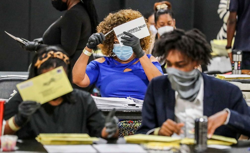 Election officials sort absentee ballots in Atlanta, where there were several runoffs taking place on August 11.