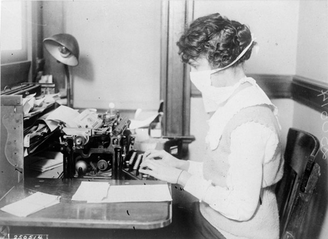 A typist wearing a mask in New York City on October 16, 1918.