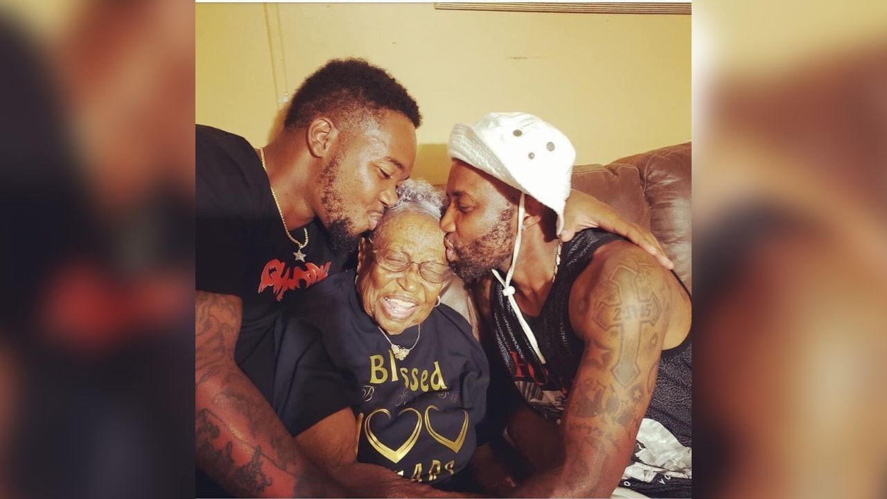 Kelley's grandsons show the 100-year-old some birthday love.
