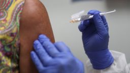 HOLLYWOOD, FLORIDA - AUGUST 07: Lisa Taylor receives a COVID-19 vaccination from RN Jose Muniz as she takes part in a vaccine study at Research Centers of America  (Photo by Joe Raedle/Getty Images)