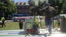 A cannon statue memorializing the US Confederacy is removed from Monument Avenue in Richmond, Virginia on July 2, 2020. (Photo by Ryan M. Kelly/AFP) 