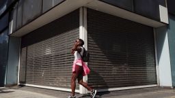 A woman walks past a vacant retail unit on Oxford Street in London, England, on July 22, 2020. UK retail sales data for June, during which non-essential shops were allowed to reopen, is set to be released by the Office for National Statistics (ONS) this Friday, July 24.  (Photo by David Cliff/NurPhoto via AP)