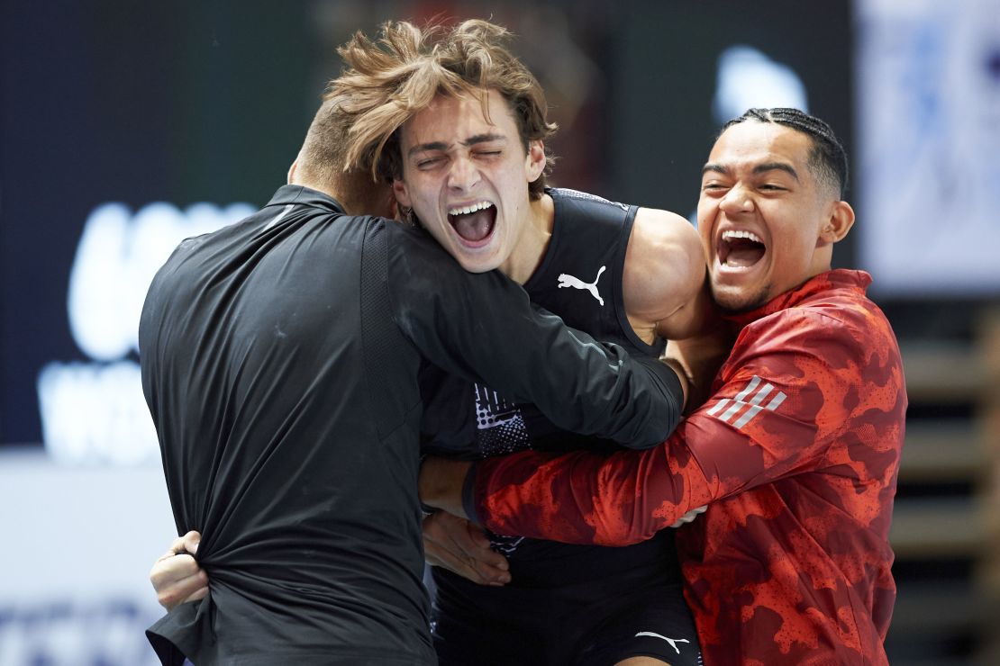Duplantis (center) celebrates after setting the world record in Torun, Poland, this February.