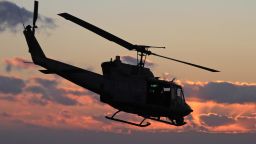 In this January 2012 file photo, a UH-1N Huey aircraft elevates after taking off near Catania, Italy.  The same model of helicopter was shot at in Virginia.