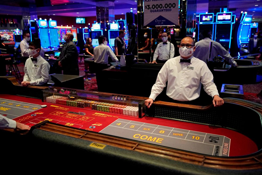 Dealers in masks await customers before the reopening of the D Las Vegas hotel and casino. 
