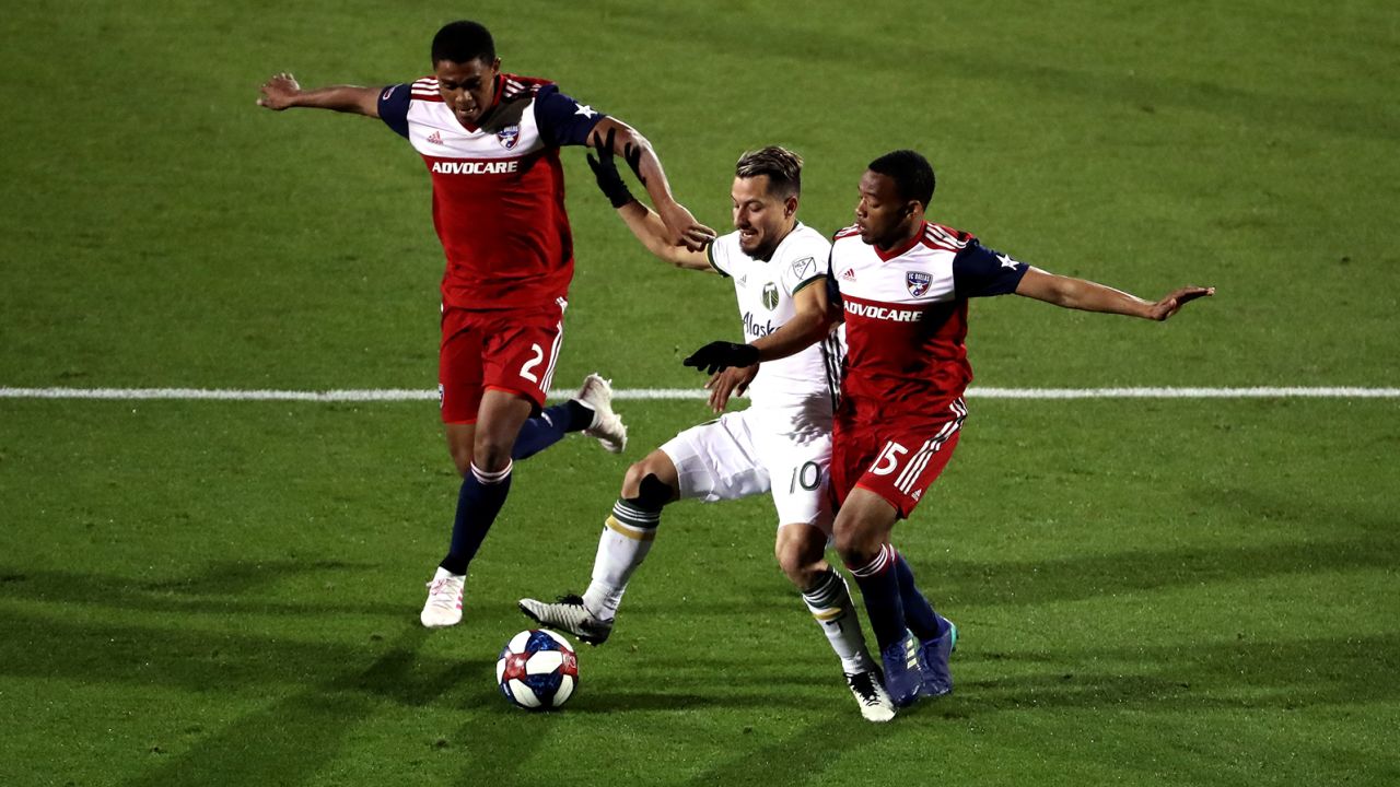 Sebastian Blanco of Portland Timbers battles for possession against Reggie Cannon and Jacori Hayes of FC Dallas at Toyota Stadium in April 2019.