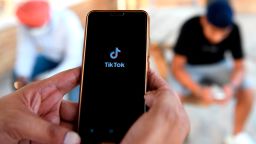 Indian mobile users browses through the Chinese owned video-sharing 'Tik Tok' app on a smartphones in Amritsar on June 30, 2020. - TikTok on June 30 denied sharing information on Indian users with the Chinese government, after New Delhi banned the wildly popular app citing national security and privacy concerns.
"TikTok continues to comply with all data privacy and security requirements under Indian law and have not shared any information of our users in India with any foreign government, including the Chinese Government," said the company, which is owned by China's ByteDance. (Photo by Narinder Nanu/AFP/Getty Images)