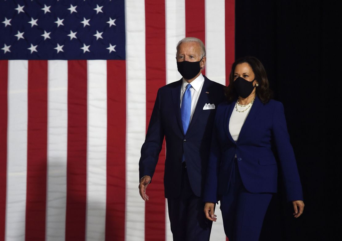 Joe Biden and Kamala Harris arrive at their first joint press conference on Wednesday wearing masks.
