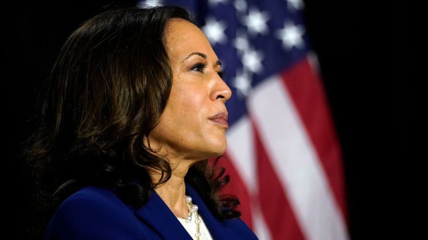 Sen. Kamala Harris, D-Calif., listens as Democratic presidential candidate former Vice President Joe Biden introduces her as his running mate at Alexis Dupont High School in Wilmington, Del., Wednesday, Aug. 12, 2020. (AP Photo/Carolyn Kaster)