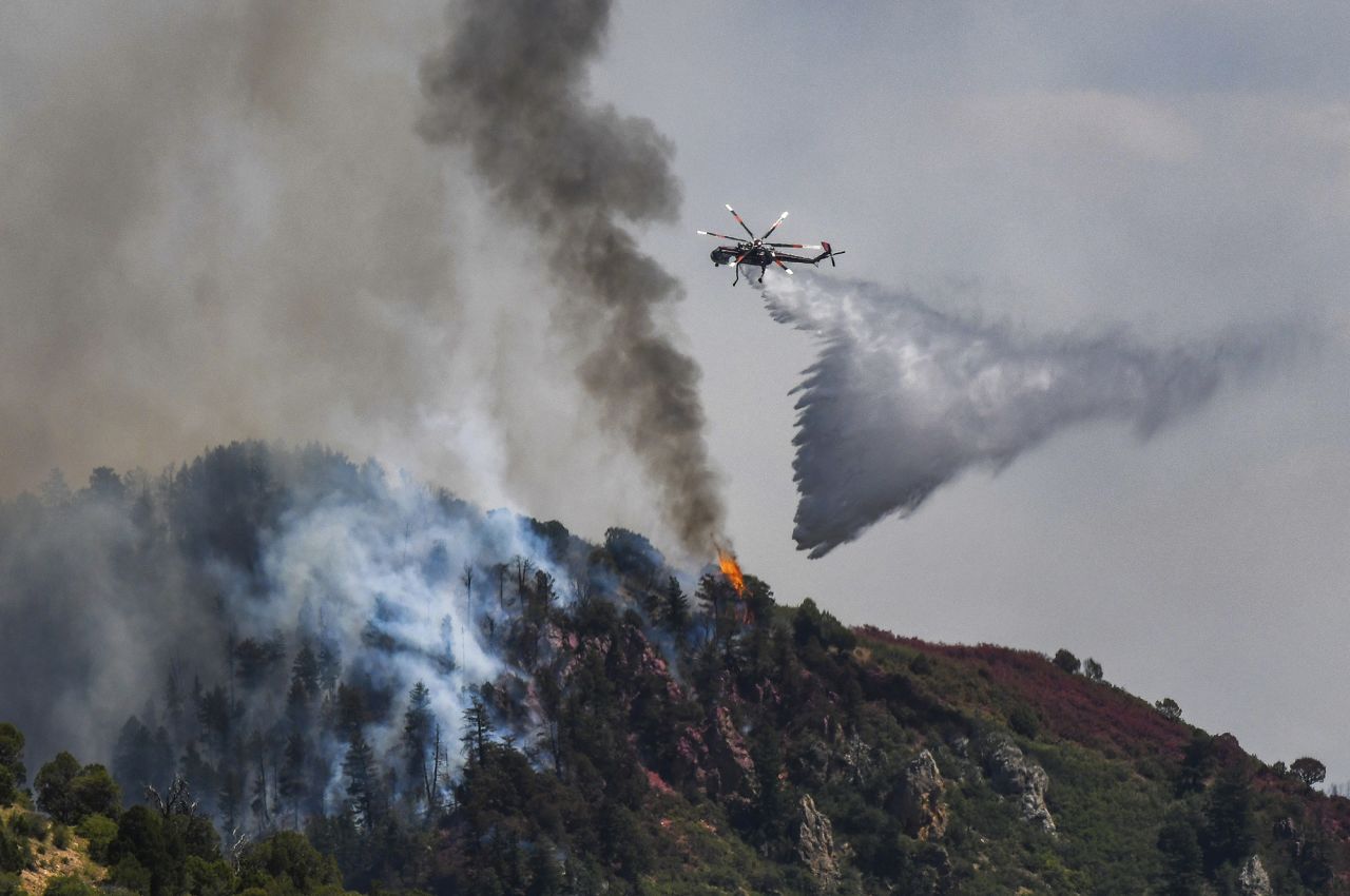 Fire crews battle the Grizzly Creek Fire near Glenwood Springs, Colorado, on August 11, 2020.