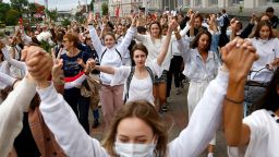 Women march in solidarity with protesters injured in the latest rallies against the results of the country's presidential election in Minsk, Belarus, on Wednesday.