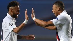 TOPSHOT - Paris Saint-Germain's Brazilian forward Neymar (L) and Paris Saint-Germain's French forward Kylian Mbappe celebrate after winning  at the end of the UEFA Champions League quarter-final football match between Atalanta and Paris Saint-Germain at the Luz Stadium in Lisbon on August 12, 2020. (Photo by David Ramos / POOL / AFP) (Photo by DAVID RAMOS/POOL/AFP via Getty Images)