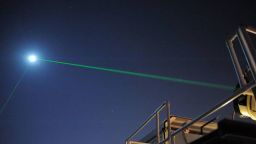 This photograph shows the laser-ranging facility at the Goddard Geophysical and Astronomical Observatory in Greenbelt, Md. The facility helps NASA keep track of orbiting satellites. Both beams shown, coming from two different lasers, are pointed at NASA's Lunar Reconnaissance Orbiter, which is orbiting the Moon. Here, scientists are using the visible, green wavelength of light. The laser facility at the Université Côte d'Azur in Grasse, France, developed a new technique that uses infrared light, which is invisible to the human eye, to beam laser light to the Moon.