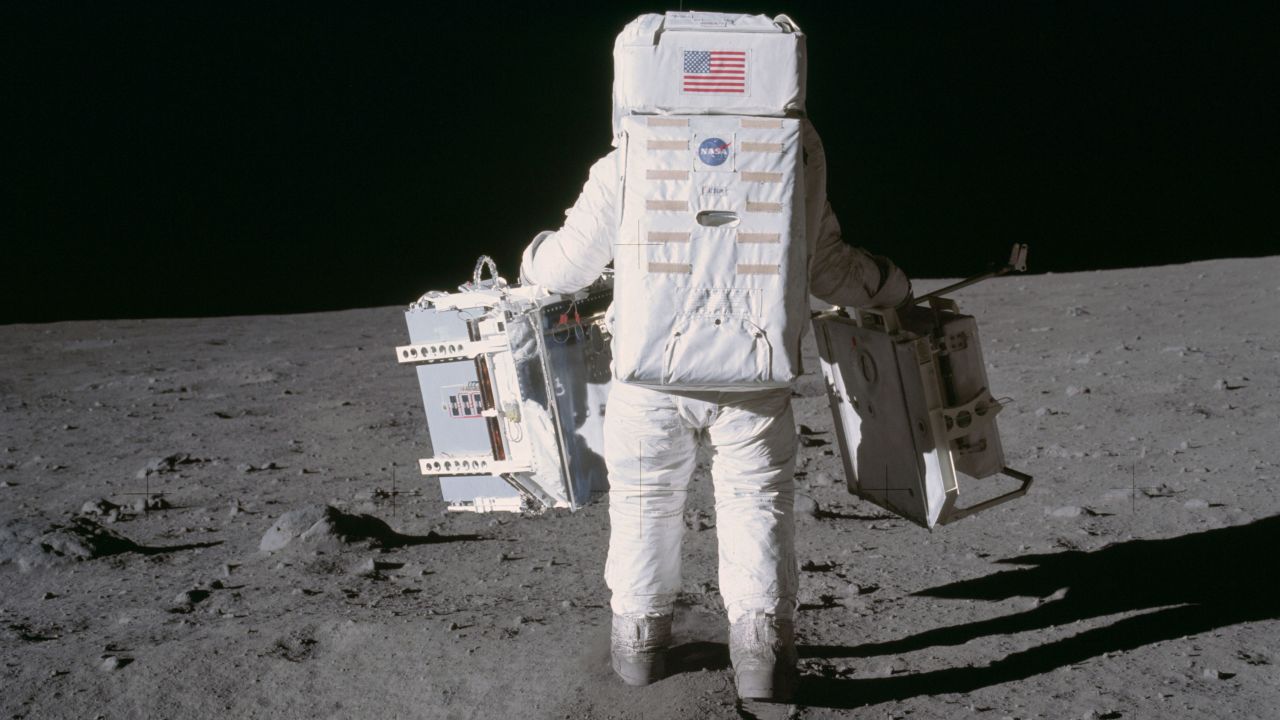 Astronaut Buzz  Aldrin placed two experiments on the moon's during the Apollo 11 extravehicular activity in 1969. In his left hand is a seismic experiment, and in his right is a laser-reflecting panel. 