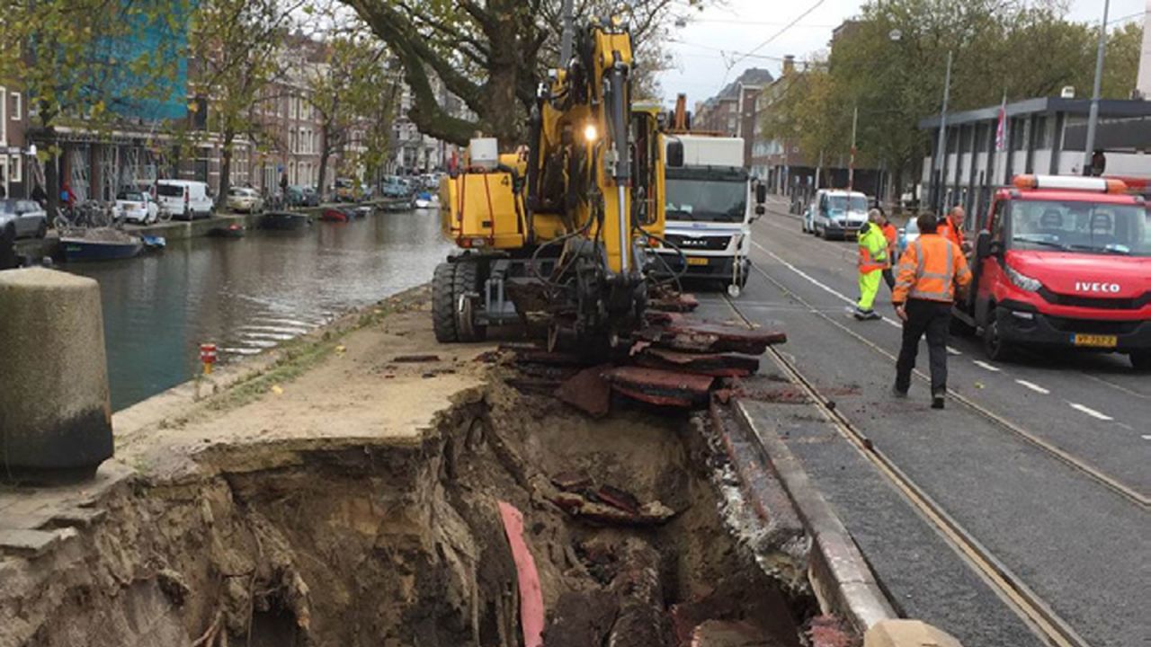 A huge sinkhole emerges along the waterside in the Dutch capital.