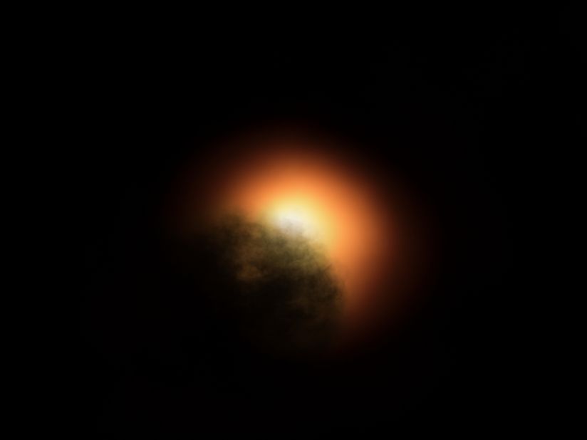 This artist's illustration shows the unexpected dimming of the star Betelgeuse.