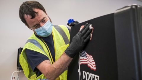 Staff of the Franklin County Board of Elections take measures to sanitize voting stations and provisional ballot envelop stations so that Ohio residents who qualify to vote in person at the Franklin County Board of Elections headquarters can do so on April 28, 2020 in Columbus, Ohio on the final day of the the primary election.