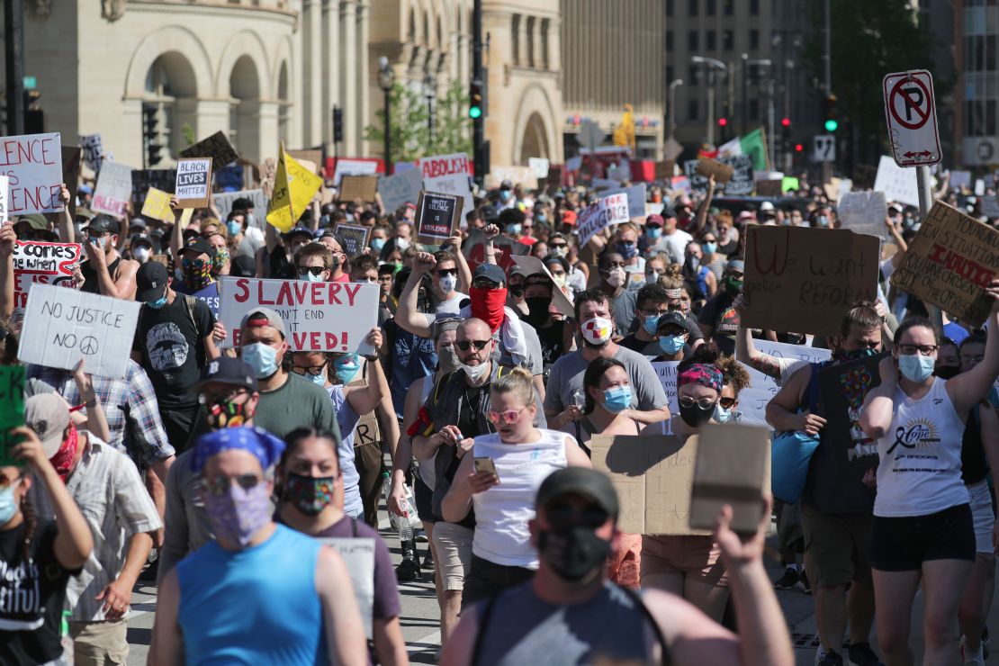 Marchers head down a Milwaukee street during a protest march against the killing of George Floyd.