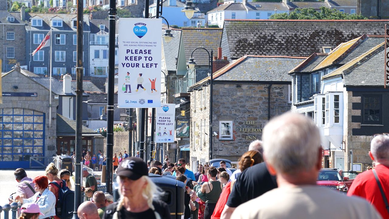 People throng the streets of St Ives, a seaside tourist town in the UK region of Cornwall. 