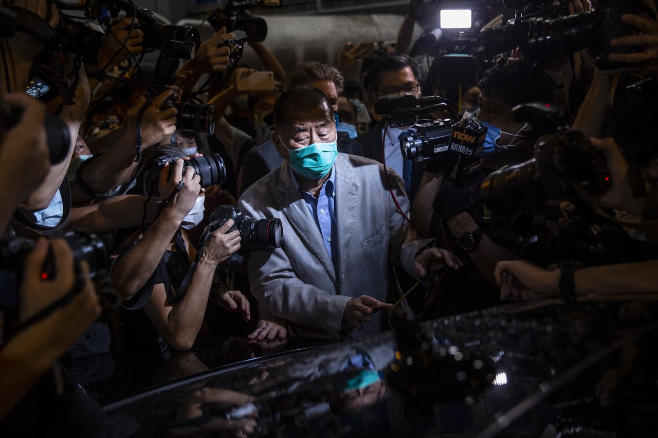 Hong Kong media tycoon Jimmy Lai, known for his support of the city's pro-democracy movement and criticism of China, pushes through the media after being released on bail on Wednesday, August 12. <a href="https://www.cnn.com/2020/08/09/media/hong-kong-security-law-jimmy-lai-intl-hnk/index.html" target="_blank">Lai had been arrested</a> on suspicion of "colluding" with foreign forces, according to local police. The offense was created by a new national security law imposed on Hong Kong by Beijing last month.