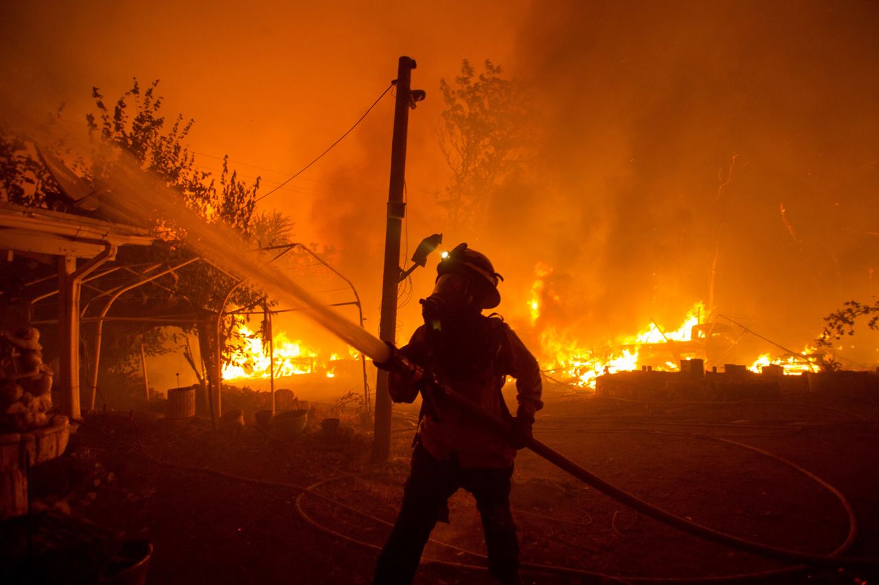 A firefighter works against the Lake Fire in Angeles National Forest, north of Santa Clarita, California, on Wednesday, August 12. Firefighters across three Western states <a href="https://www.cnn.com/2020/08/13/us/wildfires-california-oregon-colorado/index.html" target="_blank">are battling wildfires that have destroyed more than 73,000 acres.</a>