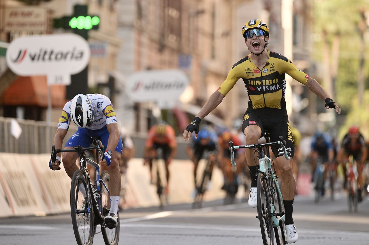 Belgian cyclist Wout van Aert, right, sprints ahead of Julian Alaphilippe to win the Milan-San Remo race in San Remo, Italy, on Saturday, August 8.