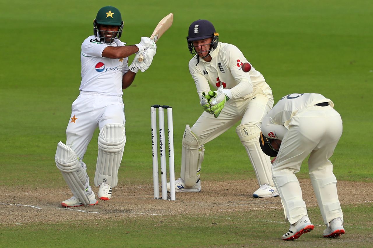 Pakistan's Asad Shafiq, left, plays a shot during a Test cricket match against England on Friday, August 7.