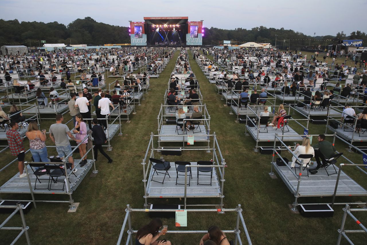 People watch Sam Fender perform at a <a href="https://www.cnn.com/travel/article/social-distanced-music-festival-intl-scli-gbr/index.html" target="_blank">socially distanced concert</a> in Newcastle, England, on Tuesday, August 11. Groups of up to five people were spaced out on raised metal platforms.