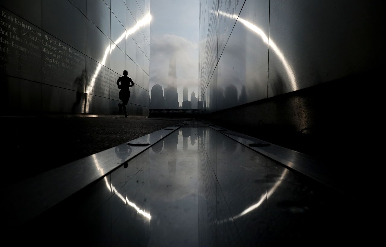 Morning fog shrouds lower Manhattan as the sun rises in New York City on Sunday, August 9.