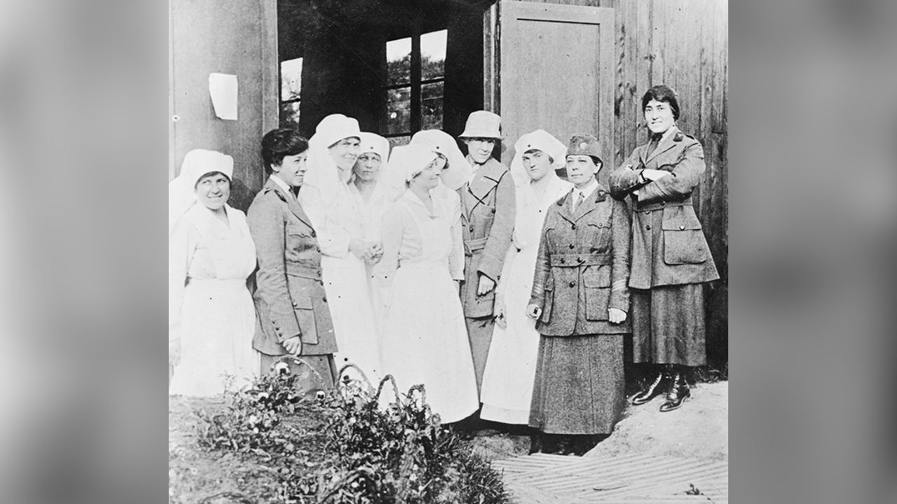 Staff of Military Unit of Women's Oversea Hospitals U.S.A. Nurses and Doctors left to right. Dr. Mary Lee Edwards. Mrs. Raymond Brown, in civilian dress in doorway. Dr. Caroline Finley. Dr. Anna Shally 