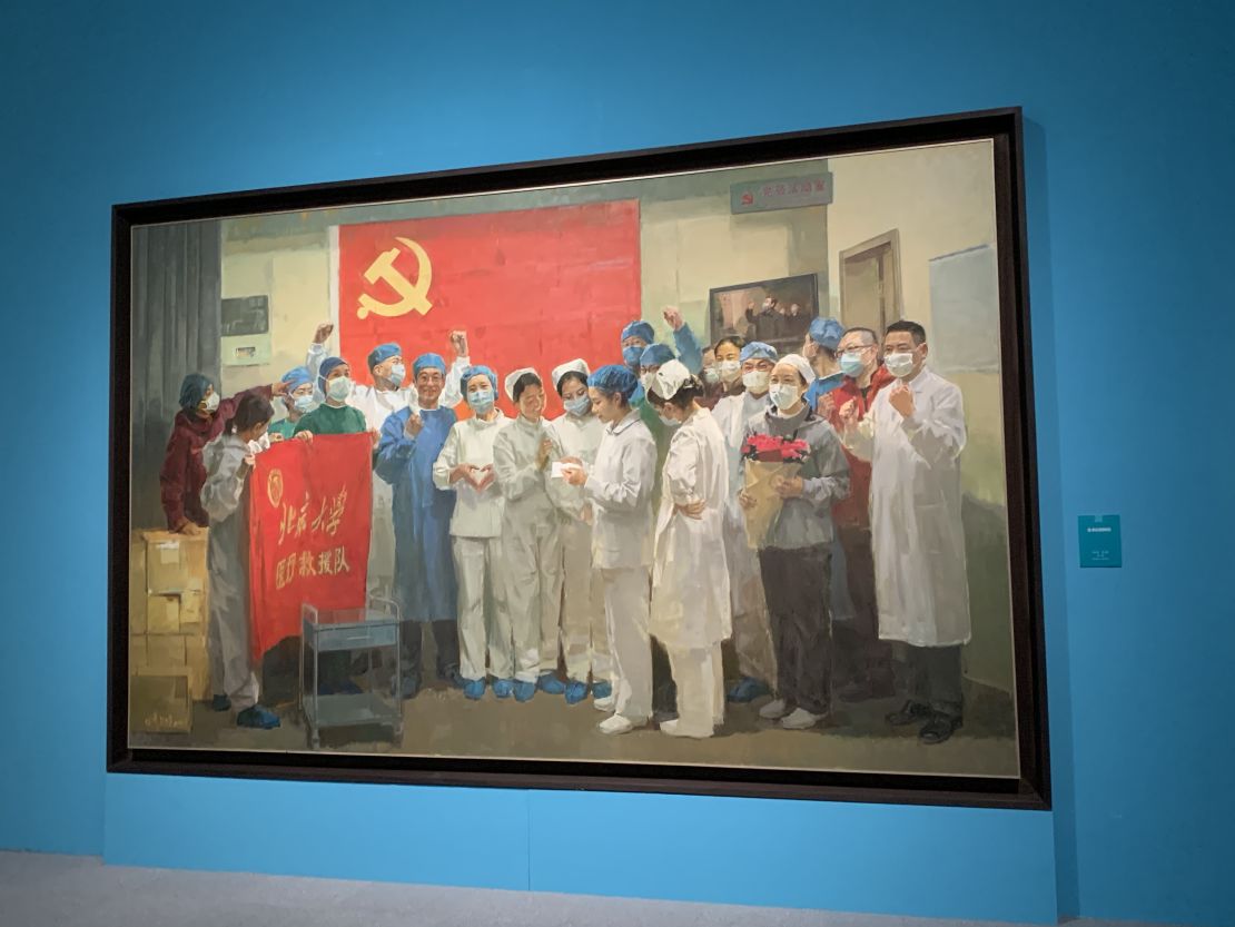 A painting of jubilant medical workers, reminscent of the style of Socialist Realism used in revolutionary artworks.