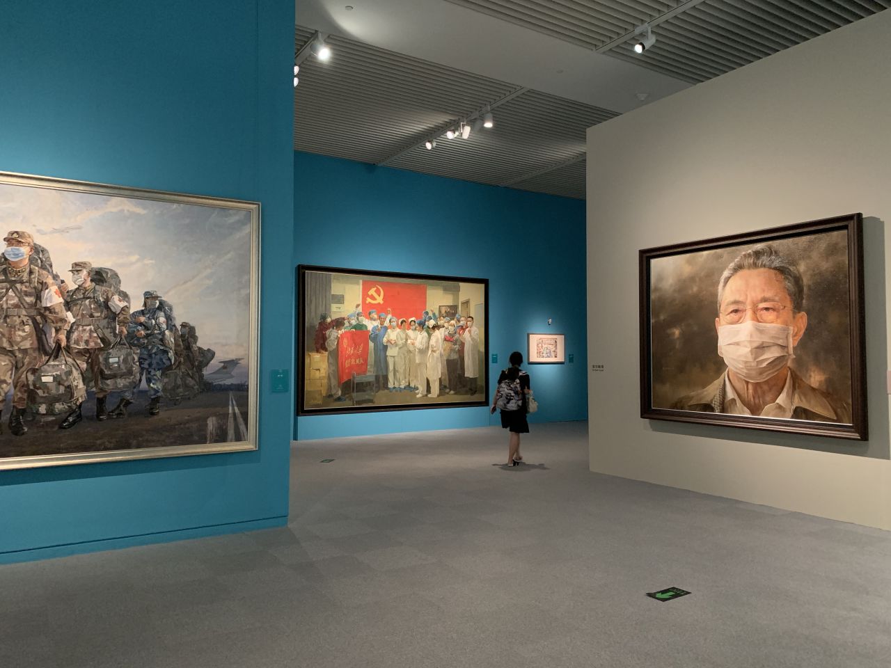 Covid-19-themed paintings on display at the National Museum of China.