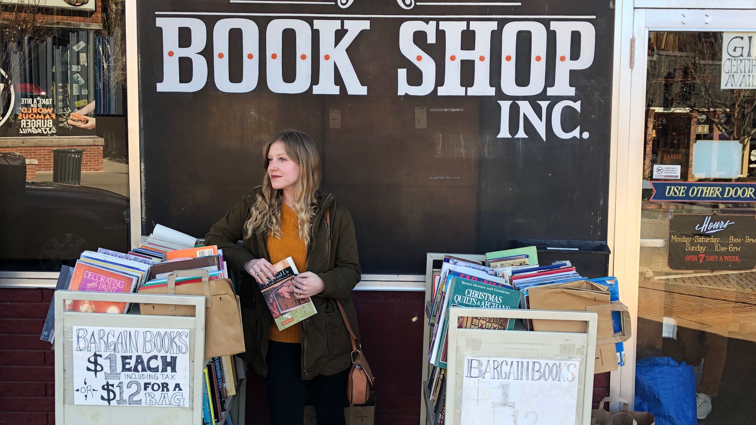 High school teacher Emma Smreker stands outside a used bookstore in Fayetteville, Arkansas. 