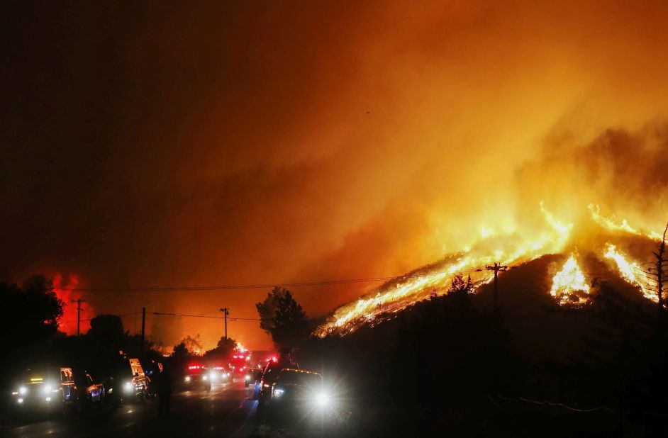 Flames and smoke from the Lake Fire rise on Wednesday, August 12, 2020.