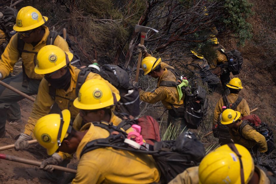 A firefighter crew works in Lake Hughes on August 13, 2020.