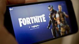 The Epic Games Inc. Fortnite: Battle Royale video game is displayed for a photograph on an Apple Inc. iPhone in Washington, D.C., U.S., on Thursday, May 10, 2018. Fortnite, the hit game that's denting the stock prices of video-game makers after signing up 45 million players, didn't really take off until it became free and a free-for-all. Photographer: Andrew Harrer/Bloomberg via Getty Images