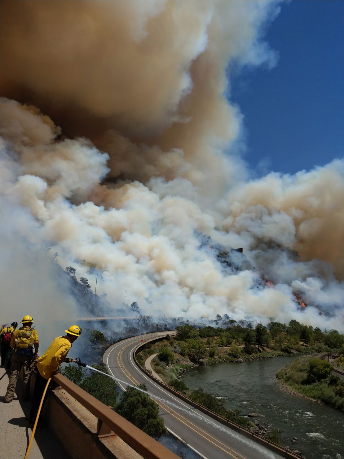 Firefighters battle the Grizzly Creek fire in Colorado on Monday, August 10.